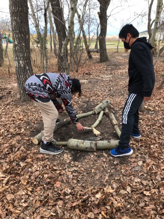 Incorporating Cree language and culture a daily affair—Warm fall weather provided a chance for students to get a hands-on Cree grammar lesson: trees are animate nouns but leaves are inanimate nouns—a distinction important in Cree thought.