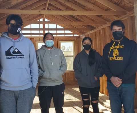 Principal Mike Willing, who began the Agri-Barn as MANS’ Construction Technology teacher last spring (far right) stands inside MANS’ newest structure this fall with some experienced construction students and some new enrollees who are looking forward to finishing the job this spring. 